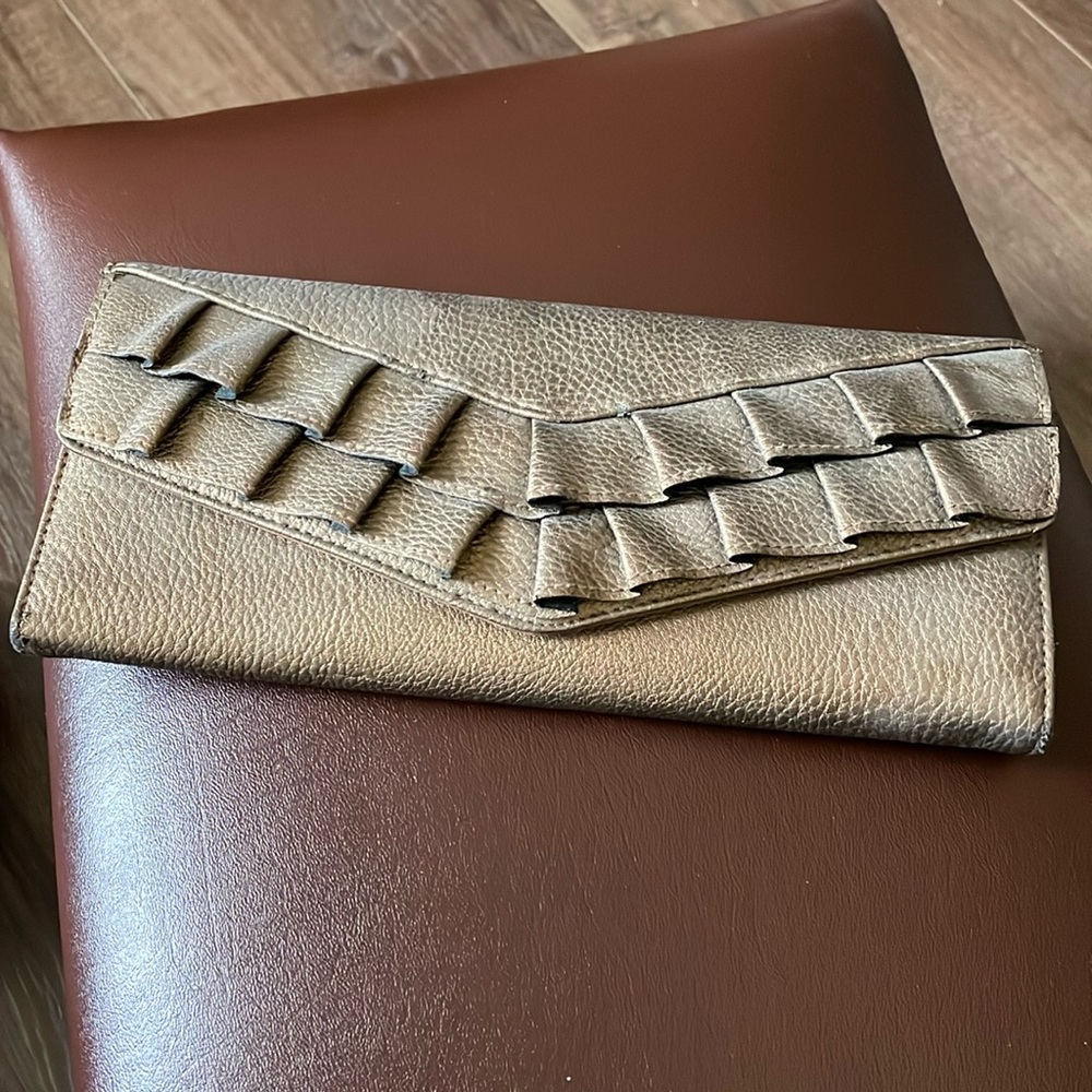 Rolf’s Bronze clutch handbag